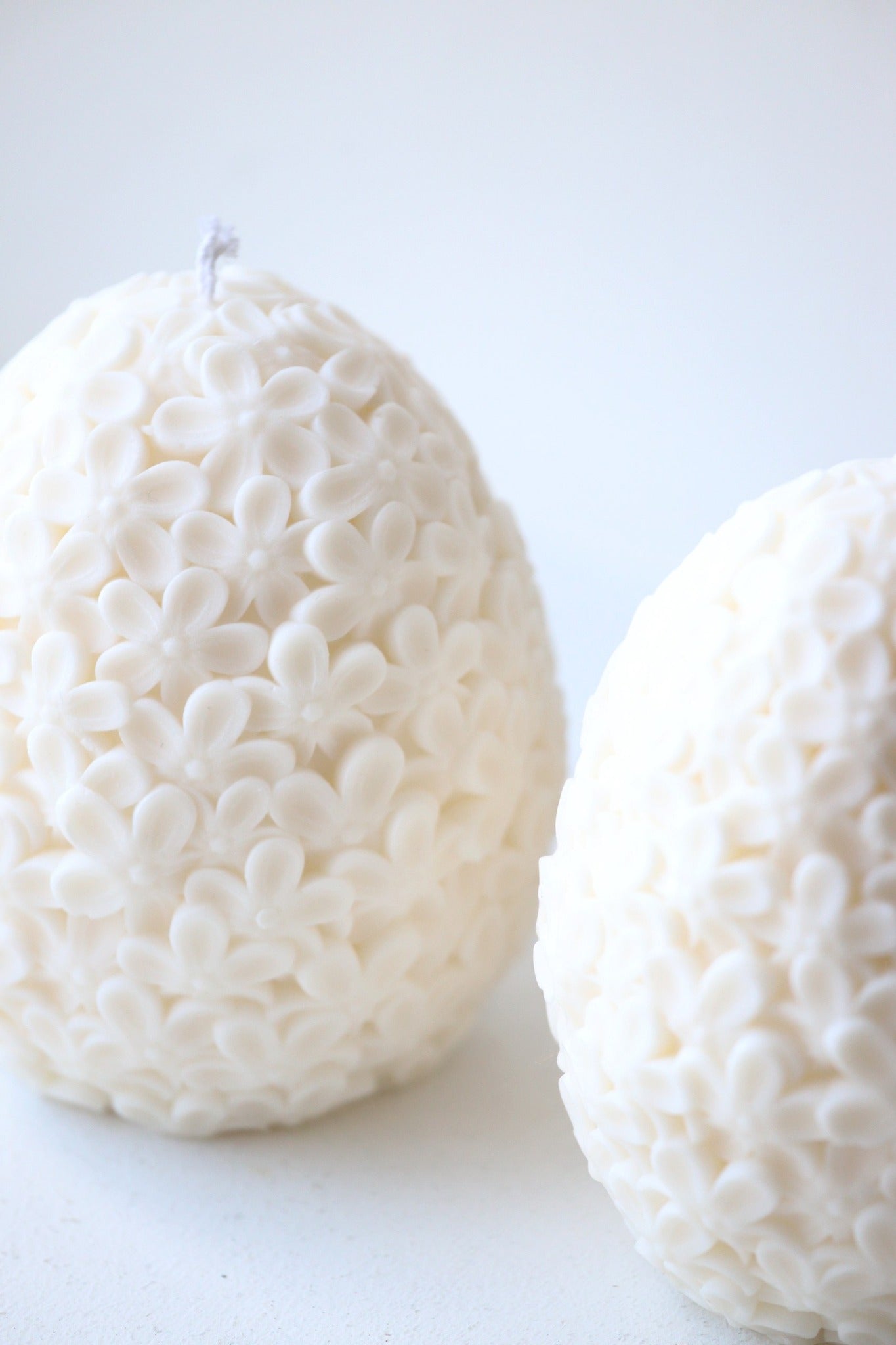 Suuremad munakujulised sireliõitega küünlad