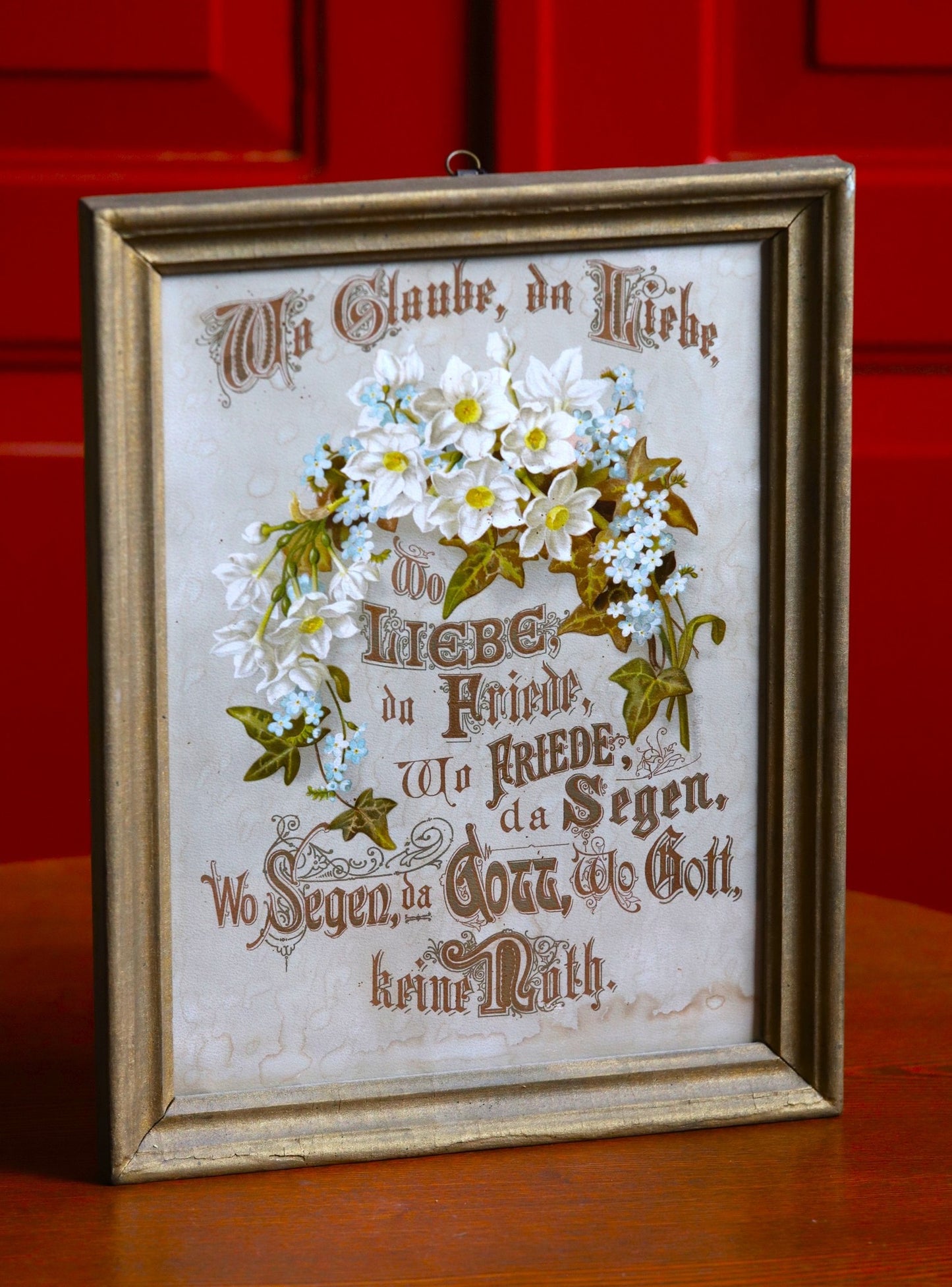 Vana saksakeelne sõnum kuldses raamis