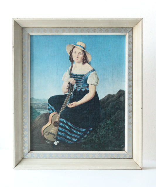 Tüdruk kitarriga/ trükipilt raamis